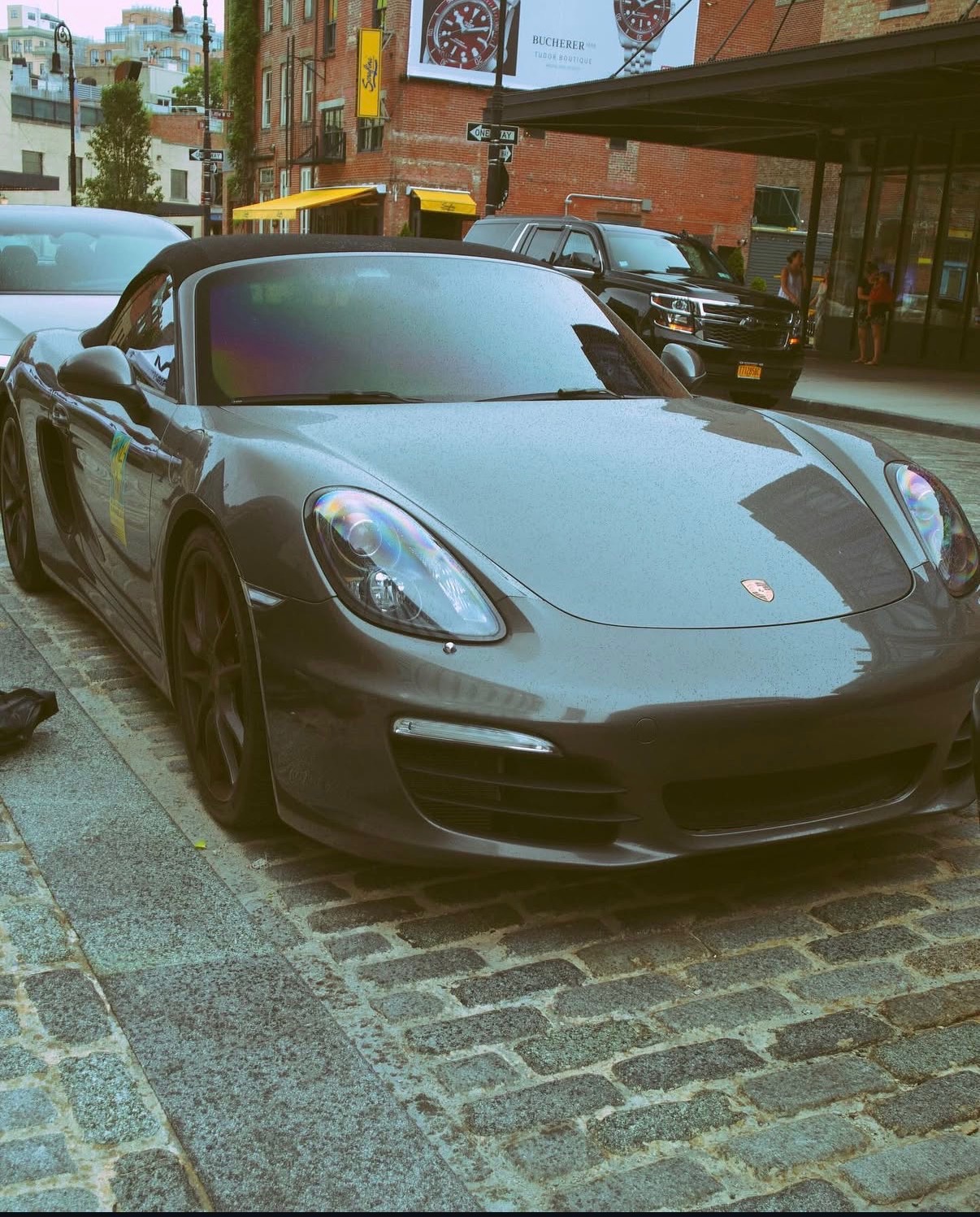 Porsche on open road captured with dramatic lighting and sharp detail